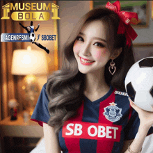 a woman wearing a sb obet jersey holding a soccer ball