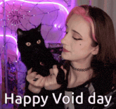 a woman with pink hair is holding a black cat with the words happy void day below her