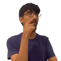 a man with glasses and a beard is pointing