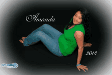 a woman in a green shirt sits on the floor with the year 2013 on the bottom