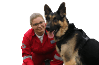 a woman kneeling next to a german shepherd wearing a vest that says rescue on it