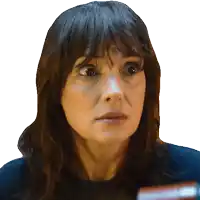 a close up of a woman 's face with a shocked look on her face