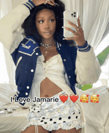 a woman taking a picture of herself with the words " i love jamarie " on the bottom