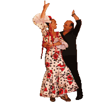 a man and woman are dancing together and the woman is wearing a floral dress