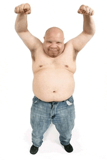 a shirtless man in jeans is flexing his muscles