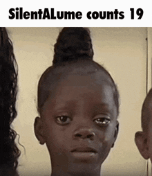 a picture of a girl with a bun on her head and the words silentalume counts 19 on the bottom