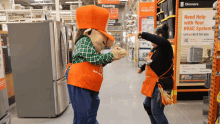 a home depot mascot dancing with a woman in front of a sign that says " need help with your hvac system "