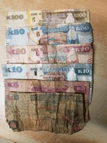 a stack of bank of zambia notes including k100 k50 k20 k10 k5 and k2