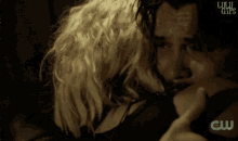 a man and a woman are hugging with the words lulu gifs on the bottom