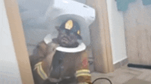 a fireman is standing in a room with smoke coming out of the door .