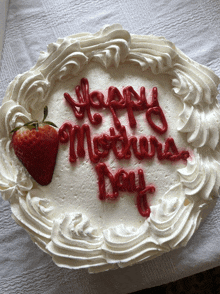 a mother 's day cake with a strawberry on it