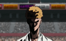 a man in a white shirt is standing in front of a crowd of people .