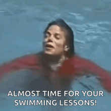 a woman in a red shirt is swimming in a pool with the words almost time for your swimming lessons .