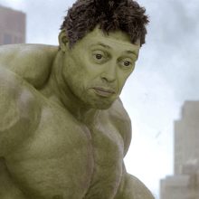 a close up of a green hulk with a serious look on his face
