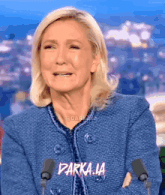 a woman in a blue jacket is crying with the words parka.la written above her