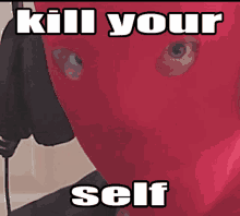 a picture of a person wearing a red mask that says kill your self on it