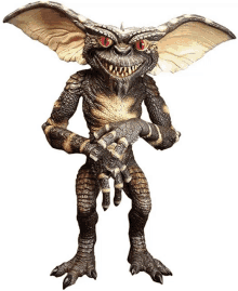 a statue of a gremlin with red eyes