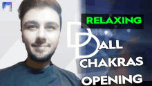 a man is smiling in front of a relaxing all chakras opening poster