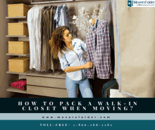 a woman is standing in a closet looking at a plaid shirt