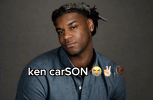 a man in a blue shirt with the name ken carson on it