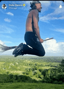 a shirtless man is flying through the air on a broom with duke dennis 17m ago