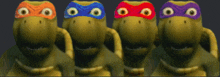 four turtles with different masks on their faces are standing next to each other