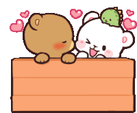 two teddy bears are kissing over a wooden box