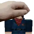 a hand is holding a cartoon character 's head in a video game .