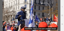 a man wearing a maga hat is giving a speech