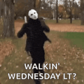 a man in a mask is running in a park and says walkin wednesday lt ?