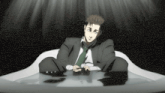 a man in a suit and tie is sitting in a bath tub