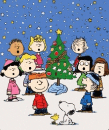 a group of peanuts characters singing christmas carols