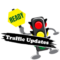 a traffic light holding a sign that says ready and traffic updates