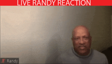 a man 's face is visible in a live randy reaction