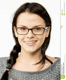 a young woman wearing glasses and braces is smiling