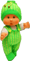 a knitted doll with a green hat and overalls