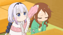 a girl petting another girl 's head with the words " is k " above them
