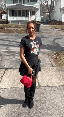 a woman wearing a black t-shirt with a rabbit on it