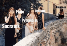 a group of women posing for a picture with plato aristotle and socrates