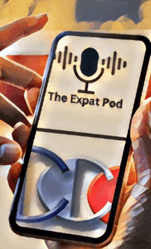 a person holding a cell phone with the expat pod on the screen