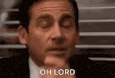 michael scott from the office is making a face with his eyes closed .