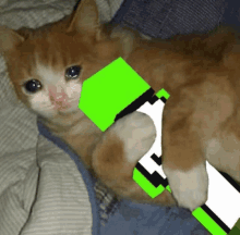 a cat is laying on a bed holding a green block with the letter a on it