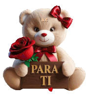 a teddy bear with a red rose and a sign that says para ti