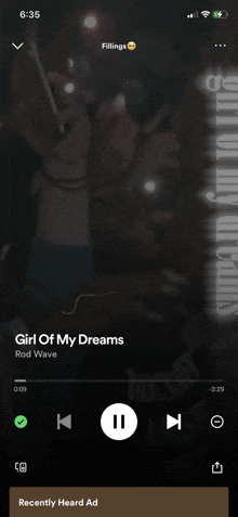 girl of my dreams by rod wave is being played on a cell phone