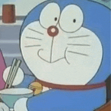 a close up of a cartoon character holding a bowl of food with chopsticks .