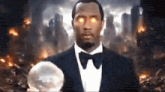 a man in a suit and bow tie is holding a crystal ball in front of a burning city