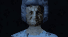 a statue of an old woman with a blue hat