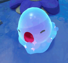 a blue and purple object with a red nose and eyes