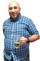 a man in a blue and white plaid shirt holds a glass of beer