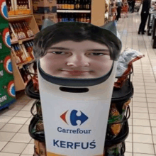 a man 's face is cut out of a carrefour kerfus sign